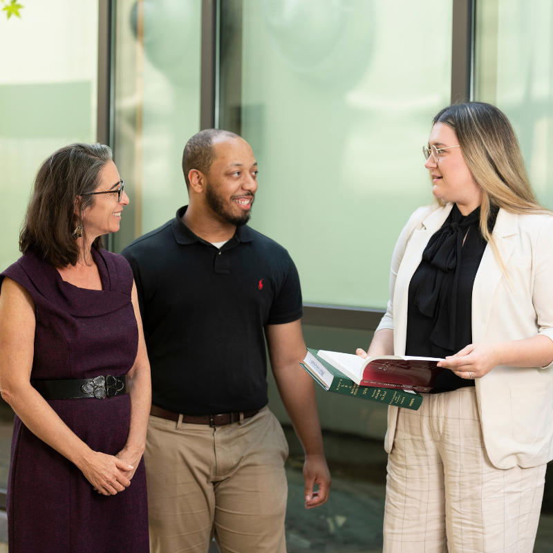 A professor with two students.