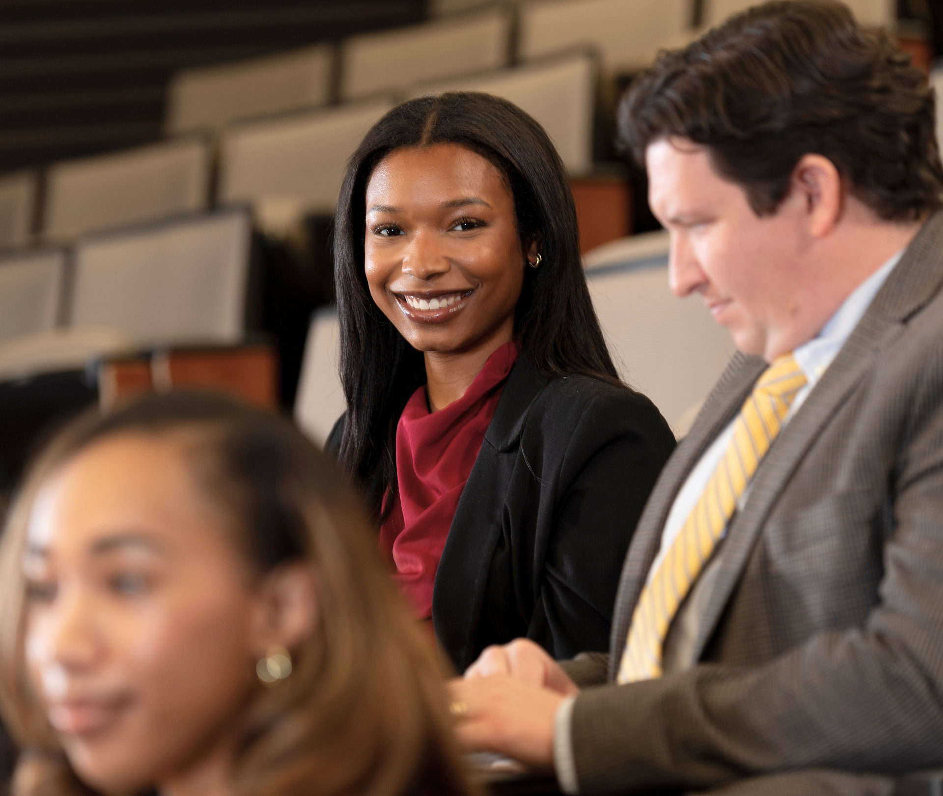 student smiling in class.