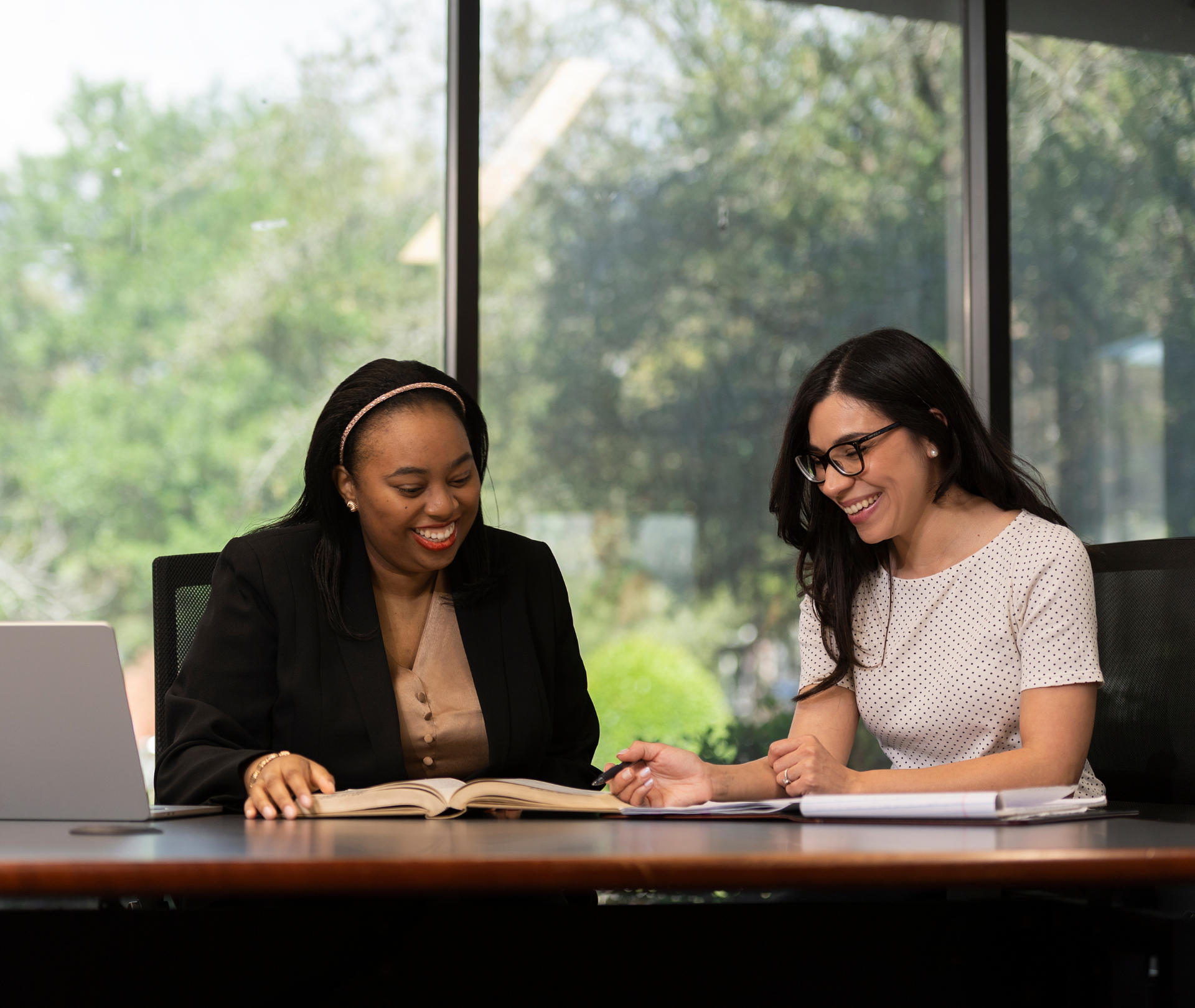 Two students studying in the library.