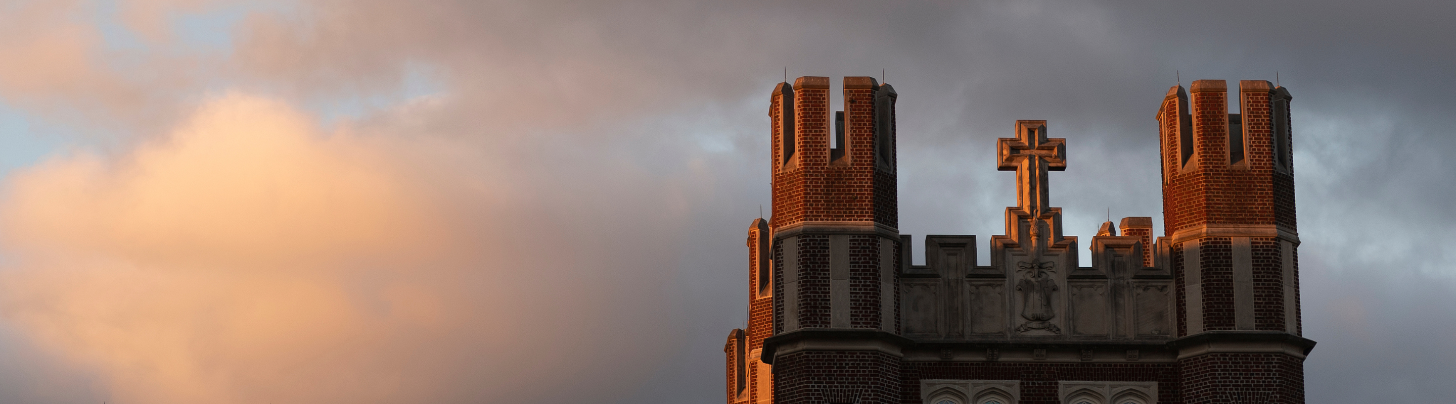 The top of Marquette Hall at sunset.