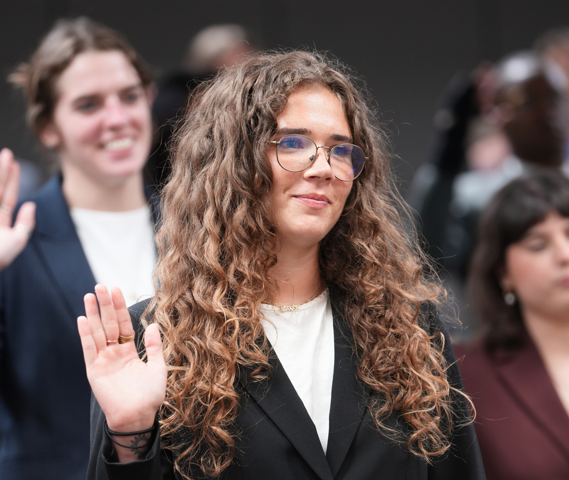 Student raising hand.