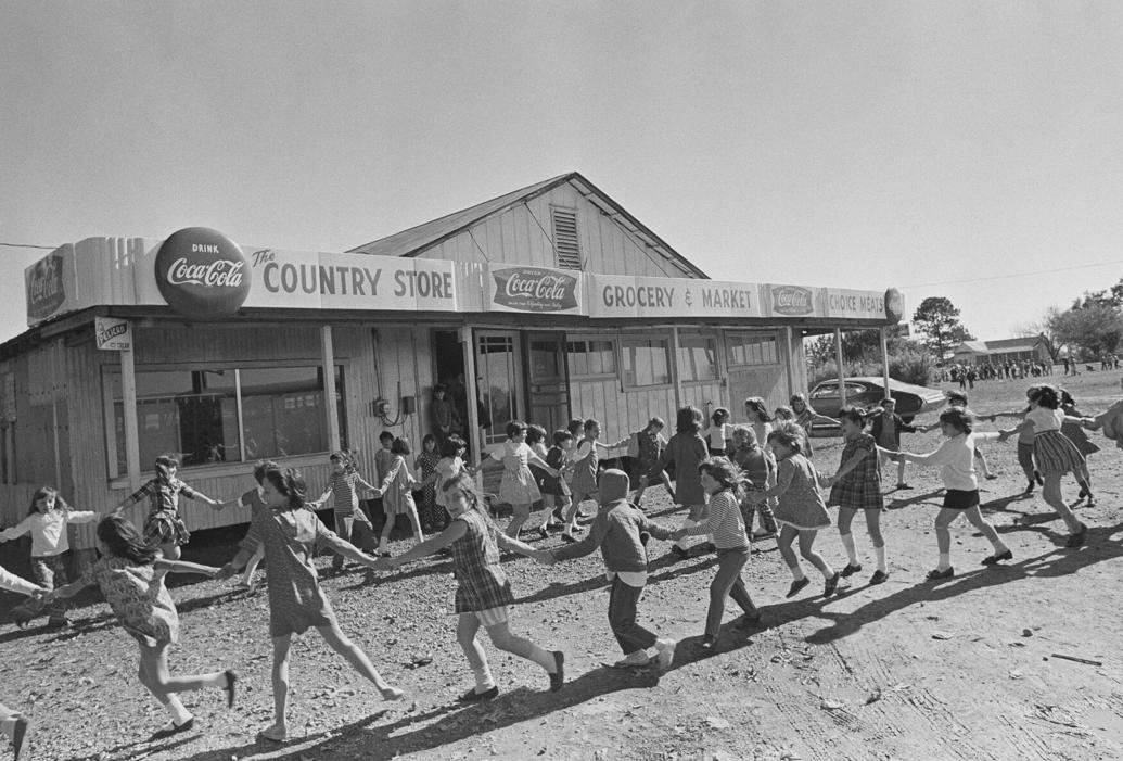 Children playing outside a make-shift school after integration was ordered for Louisiana schools.