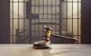 image of gavel in front of jail cell 
